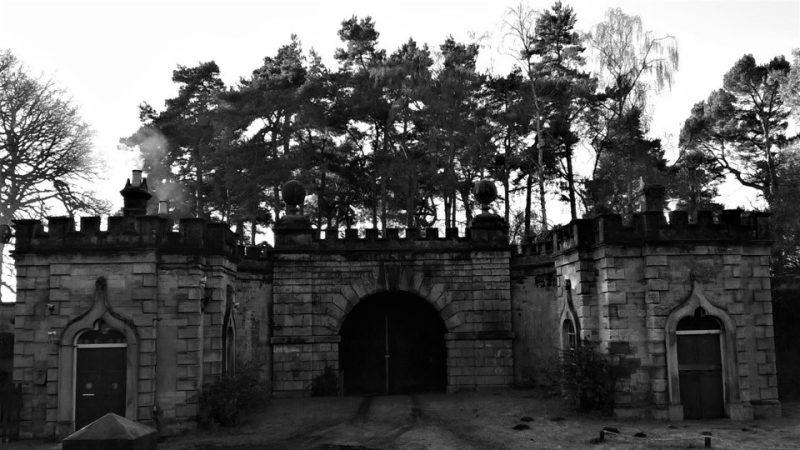 This photograph was taken on an ice cold February morning. The derelict tunnel entrance is boarded up and is covered with scrambling brambles. Smoke drifts across from a home adjacent to the tunnel, part of the original outbuildings of the estate. A yellow sunflower windmill turned in an almost still wind and chickens chattered quietly.